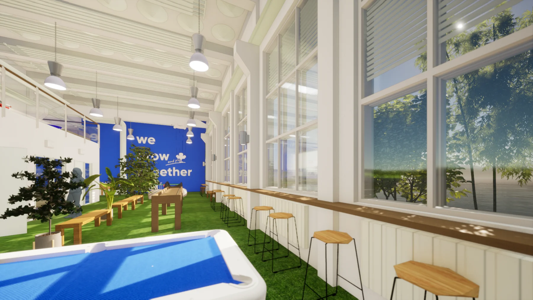 Vista longitudinal do espaço de convivência, com piso de grama sintética, mesas comunitárias e o mural we grow together ao fundo