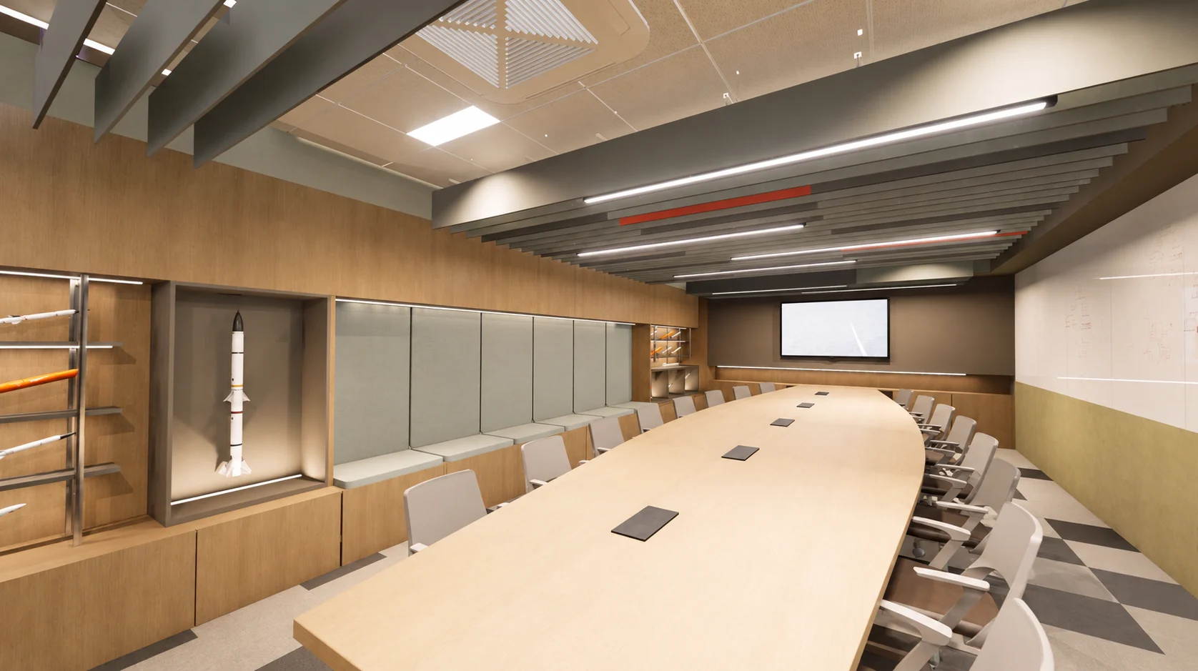 Sala de conferências com mesa longa e nicho expositivo iluminado com maquete de foguete