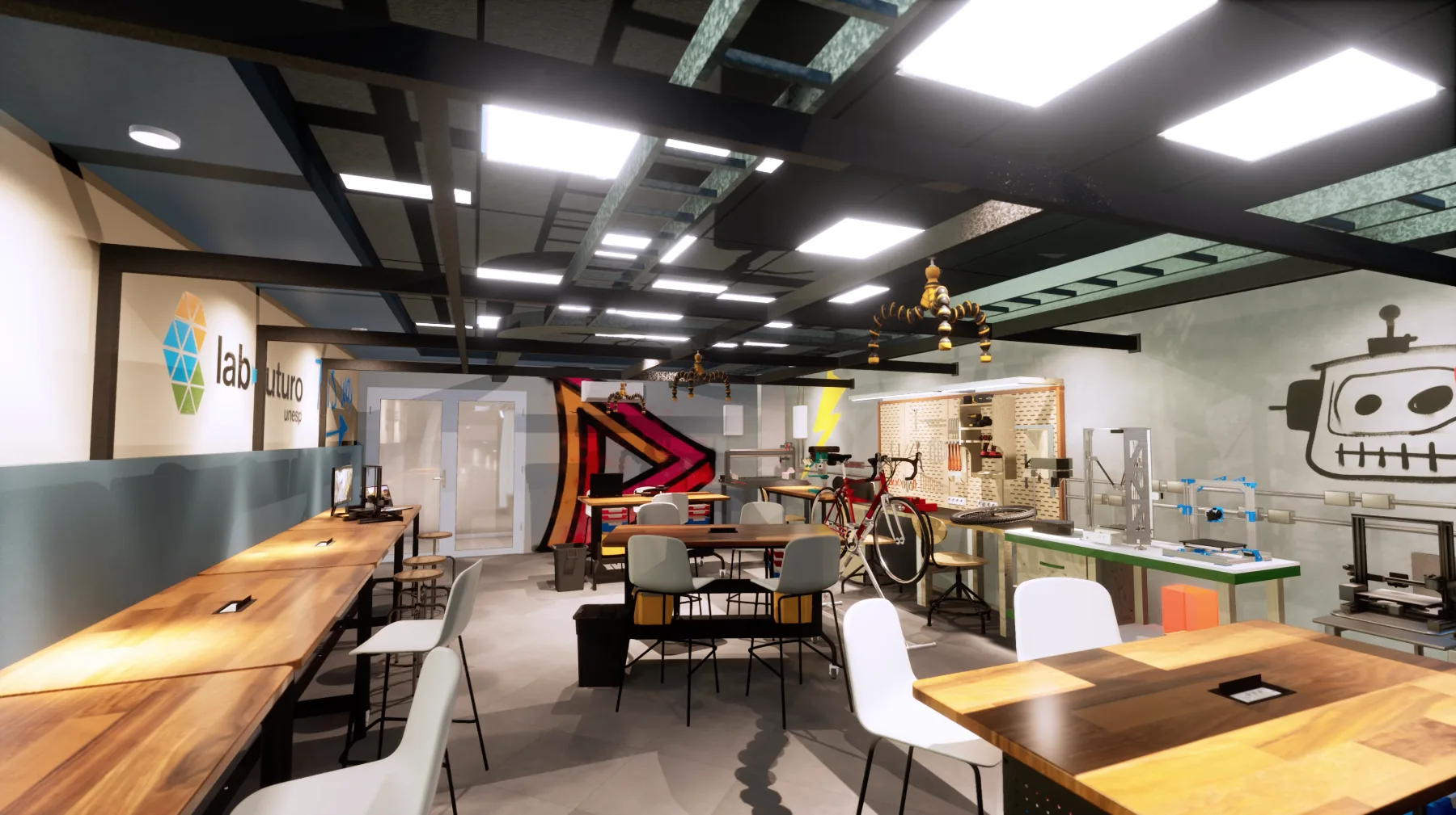 Área maker vista da bancada longa, com grafismos nas paredes, mesas móveis e painel de ferramentas